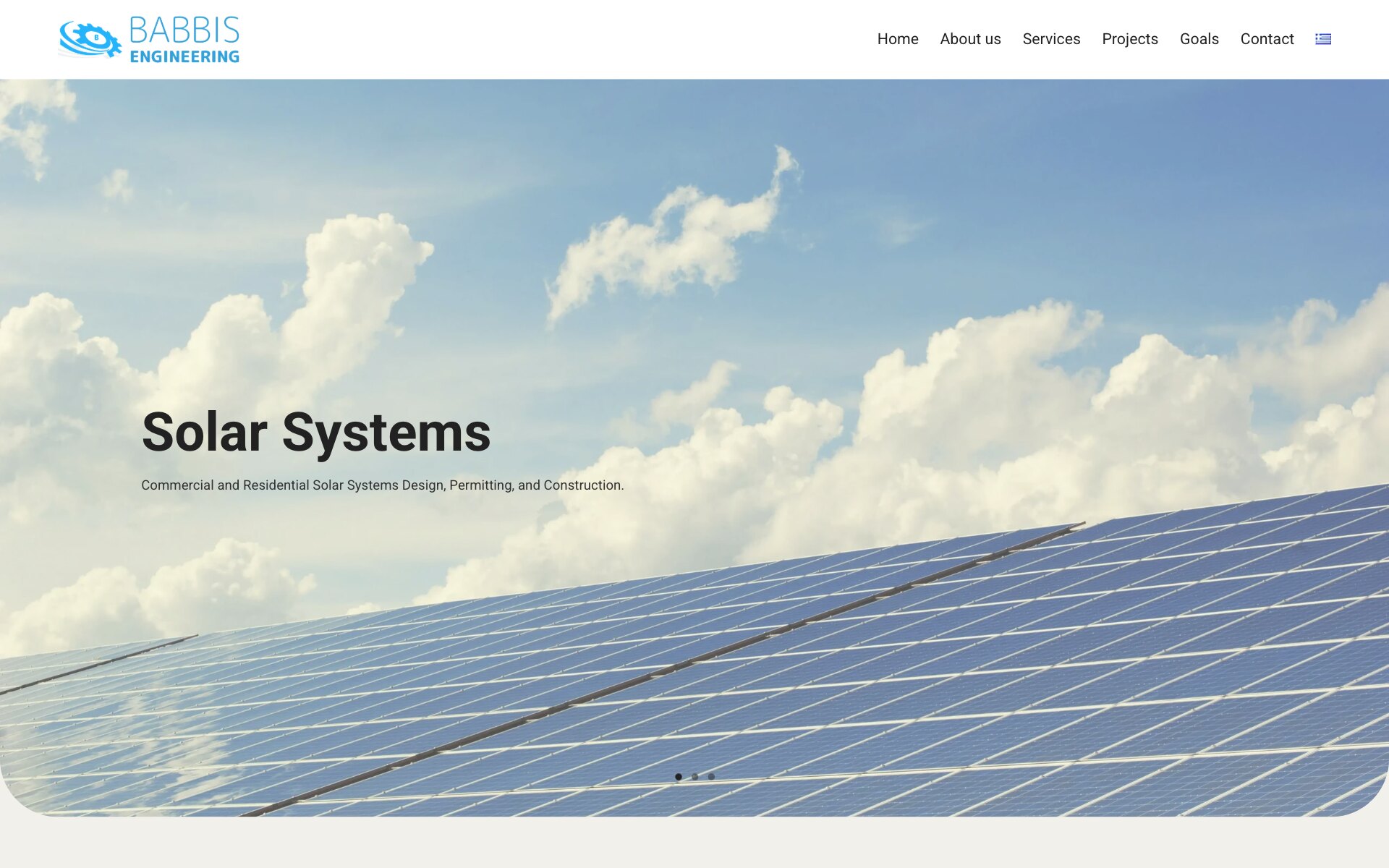 The Babbis Engineering home page in English: the blue logo of a gear with a swoosh and the menu Home, About us, Services, Projects, Goals and Contact with a Greek flag; over a photograph of rows of solar panels under a blue sky with white clouds, its lower corners rounded, the heading "Solar Systems", the line "Commercial and Residential Solar Systems Design, Permitting, and Construction." and three slide dots at the bottom.