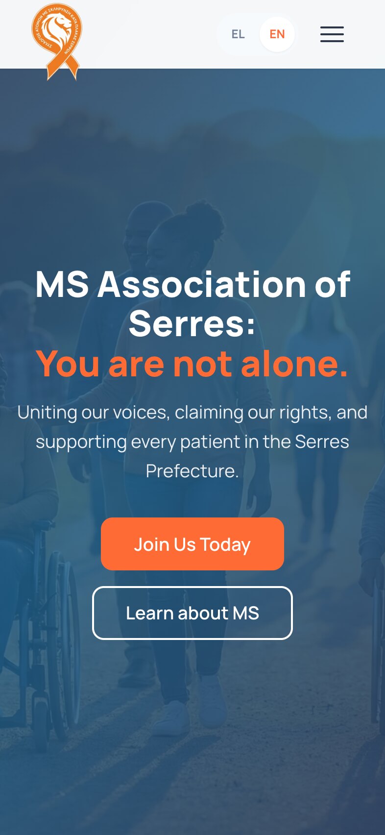The home page on a phone: the ribbon logo, the EL/EN switch and a menu button, then the headline "MS Association of Serres: You are not alone." over three lines, the supporting line, and the "Join Us Today" and "Learn about MS" buttons stacked, on the blue-tinted photograph of people walking outdoors.
