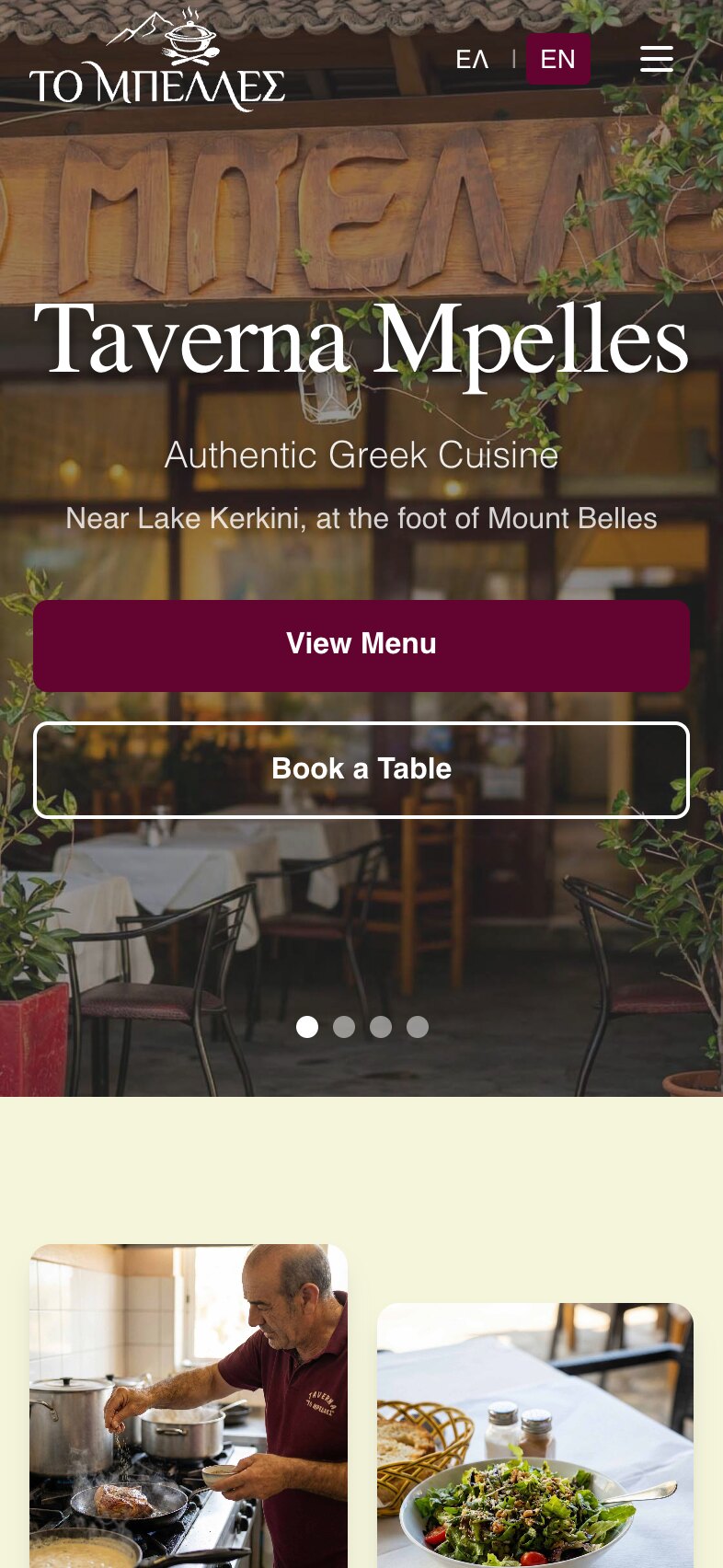 The home page on a phone: the logo, the ΕΛ | EN switch and a menu button over the carved sign, the heading "Taverna Mpelles" across the width, the two lines, full-width "View Menu" and "Book a Table" buttons and the slide dots; below, on a cream background, a person in the taverna's burgundy polo shirt seasoning meat in a pan at a stove, and a salad beside a bread basket.