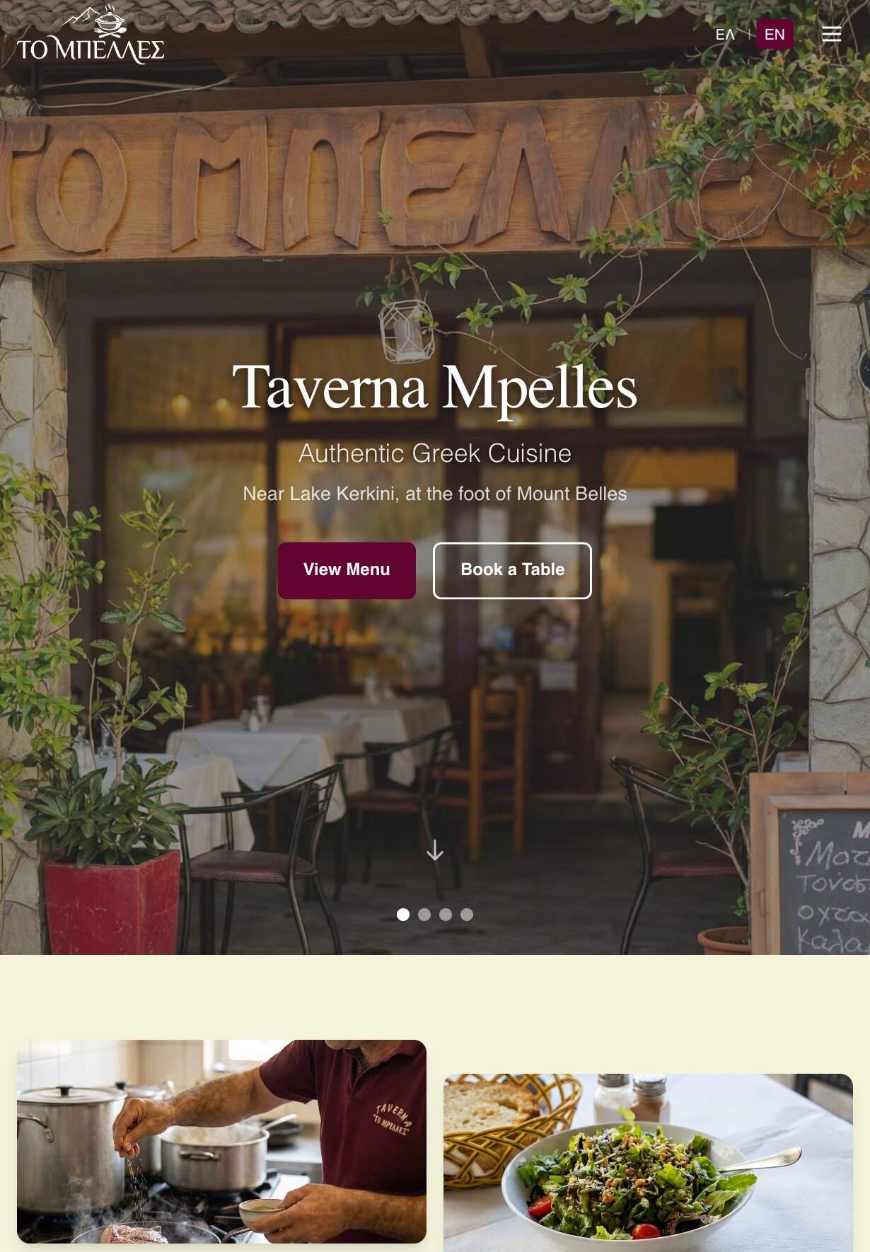 The home page on a tablet: the logo, the ΕΛ | EN switch and a menu button over the photograph of the carved sign and the tables inside, with the heading, both lines and the "View Menu" and "Book a Table" buttons in the middle; below the photograph, on a cream background, the tops of two photographs: a person in a burgundy polo shirt with the taverna's logo seasoning food at a stove, and a green salad beside a bread basket.